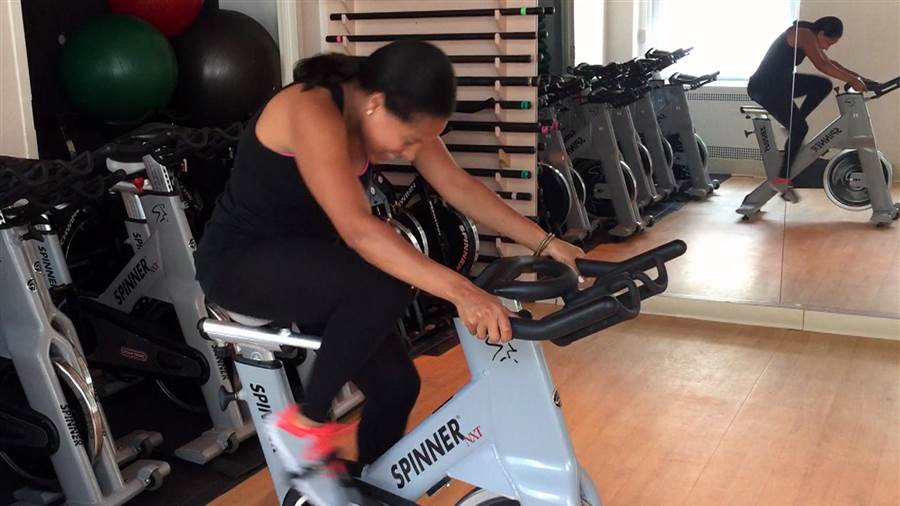 Cycling Workout to Help You Hate Running Less woman head down